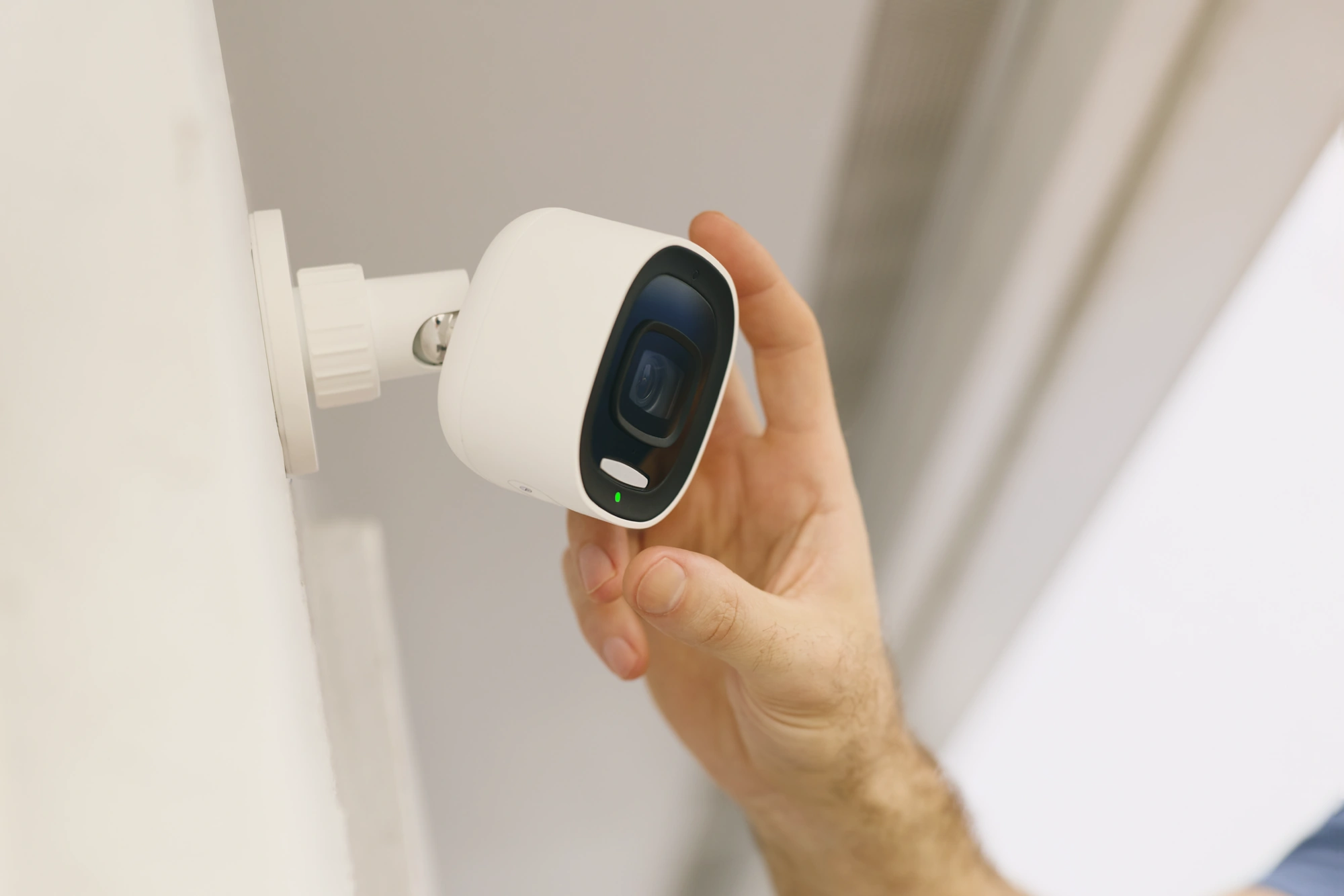 Alarm.com ADC-V730 mounted for outdoor surveillance coverage