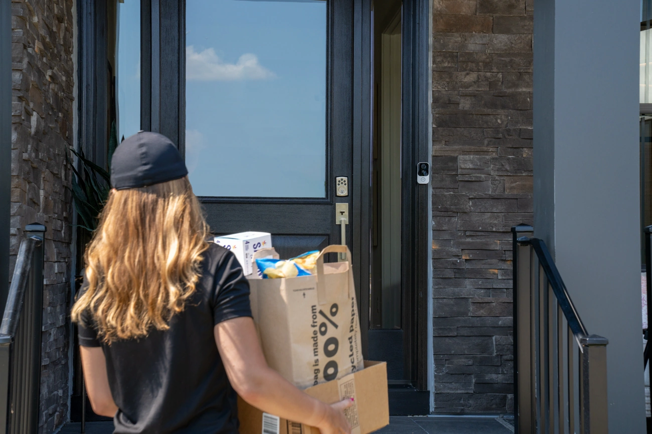 Alarm.com ADC-VDB755P capturing a delivery at the front door